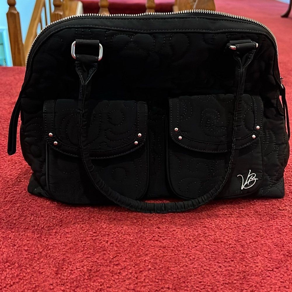 Vera Bradley purse. Black exterior with flower interior.